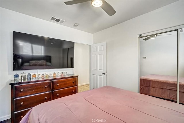 bedroom with hardwood / wood-style flooring and ceiling fan