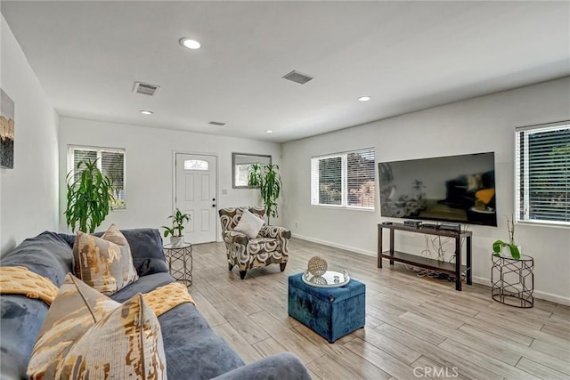 living room with light hardwood / wood-style floors