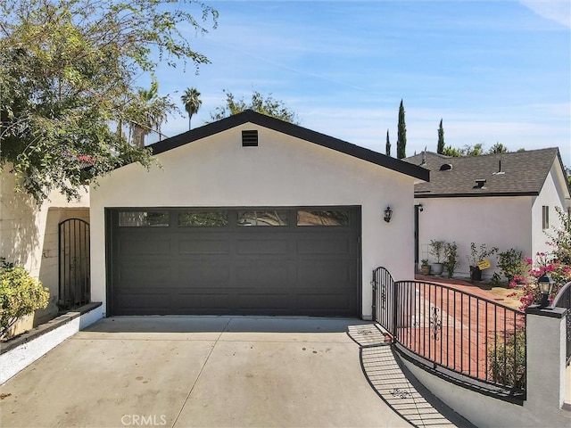 ranch-style home featuring a garage