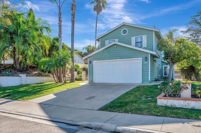 view of property featuring a garage and a front lawn