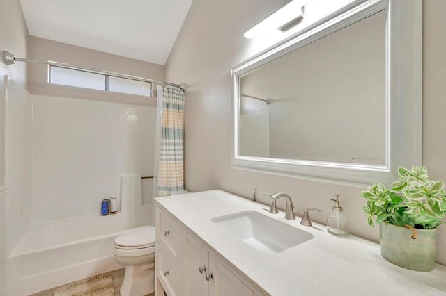 full bathroom featuring toilet, shower / tub combo, vanity, and vaulted ceiling