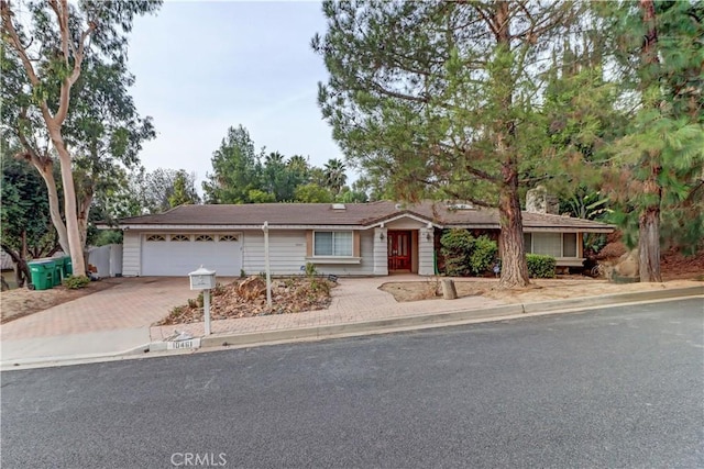 ranch-style home featuring a garage