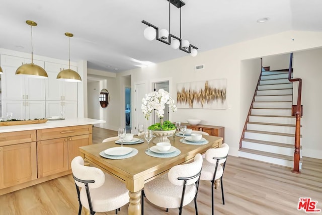 dining space featuring light wood-type flooring