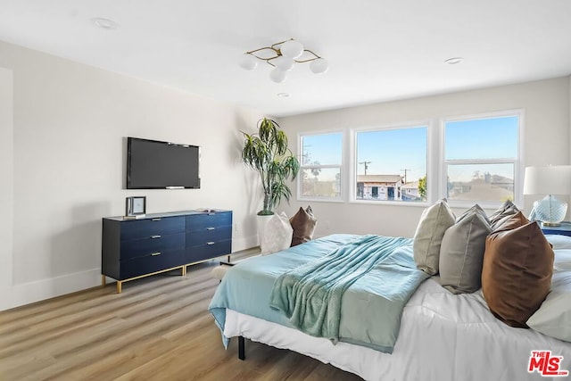 bedroom featuring wood-type flooring