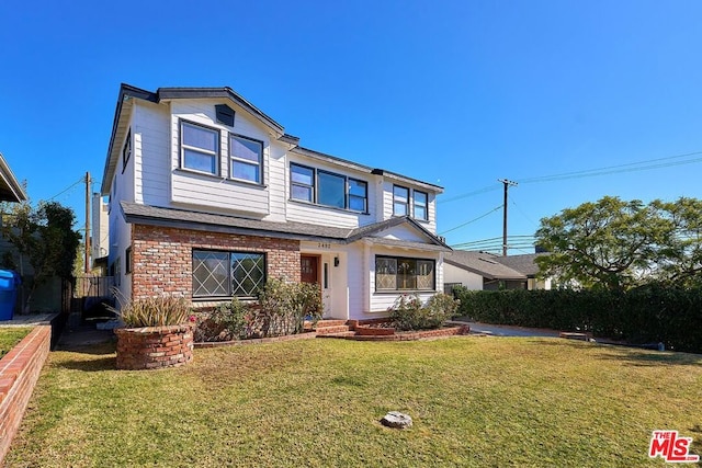 view of property featuring a front yard