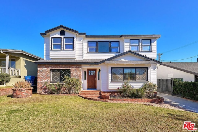 view of front of home with a front lawn