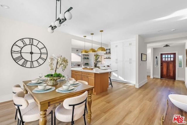 dining room with light wood-type flooring