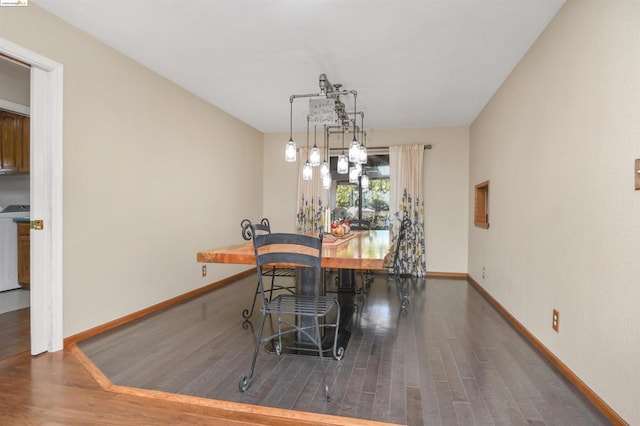 dining area featuring dark hardwood / wood-style floors