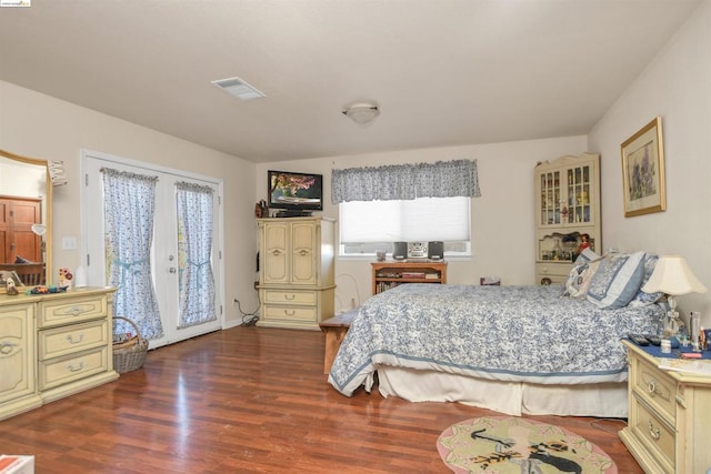 bedroom with french doors, access to outside, and dark wood-type flooring