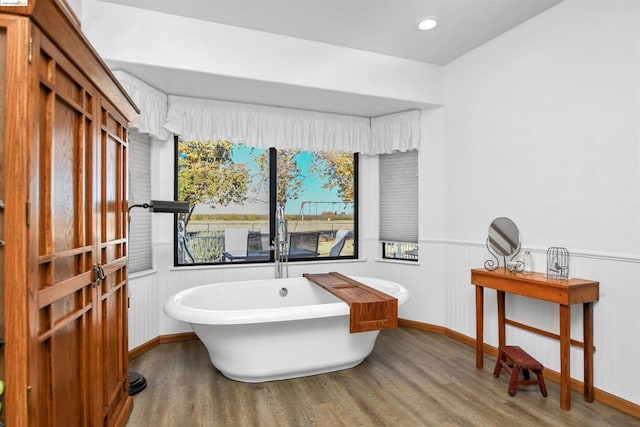 bathroom featuring hardwood / wood-style flooring and a bathtub