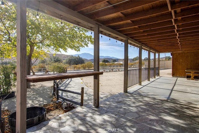 view of patio / terrace with a mountain view