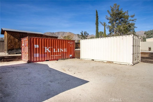 view of gate featuring a mountain view