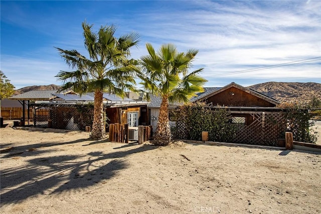 rear view of property with a mountain view