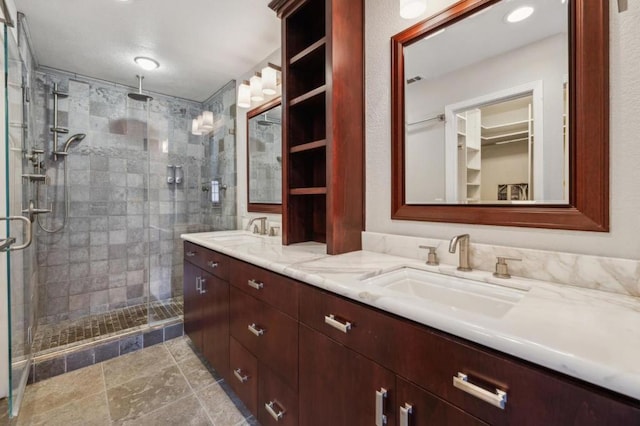 bathroom with vanity and an enclosed shower