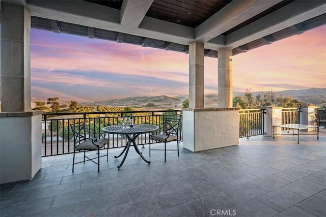 balcony at dusk with a mountain view