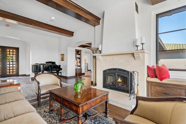 living room with beam ceiling and hardwood / wood-style floors