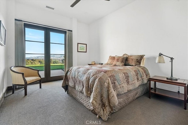 carpeted bedroom featuring access to outside and ceiling fan