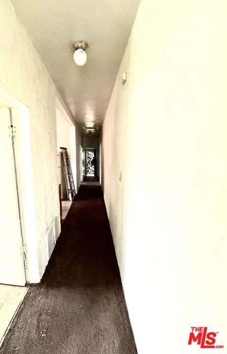 corridor featuring carpet