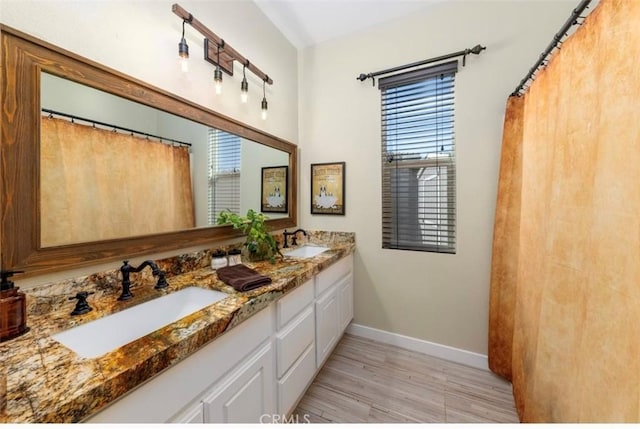 bathroom featuring vanity and hardwood / wood-style flooring