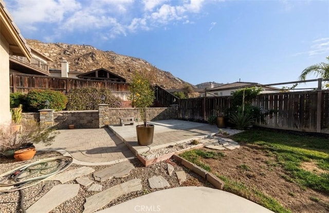 view of patio / terrace featuring a mountain view