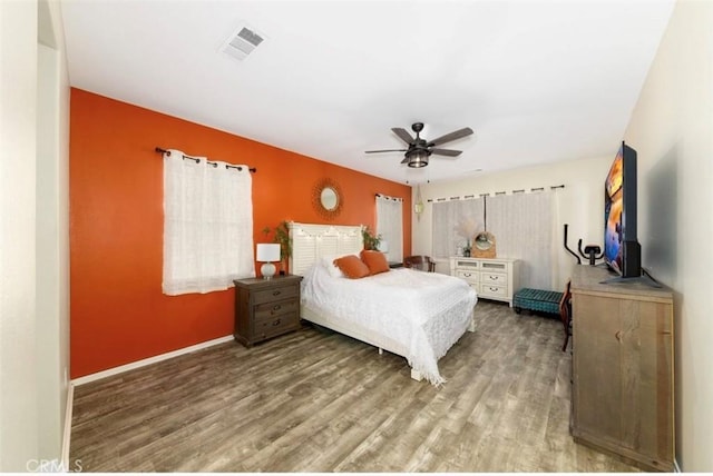 bedroom featuring hardwood / wood-style floors and ceiling fan