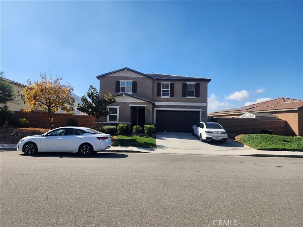 front of property with a garage