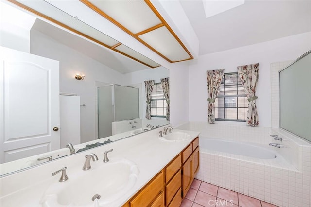 bathroom with tile patterned flooring, vanity, vaulted ceiling, and plus walk in shower