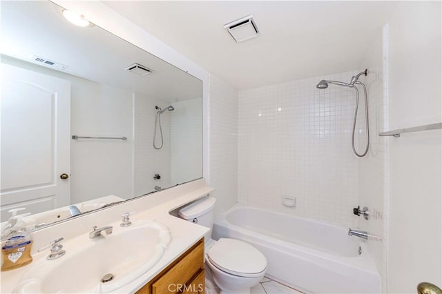 full bathroom with vanity, toilet, tiled shower / bath combo, and tile patterned flooring