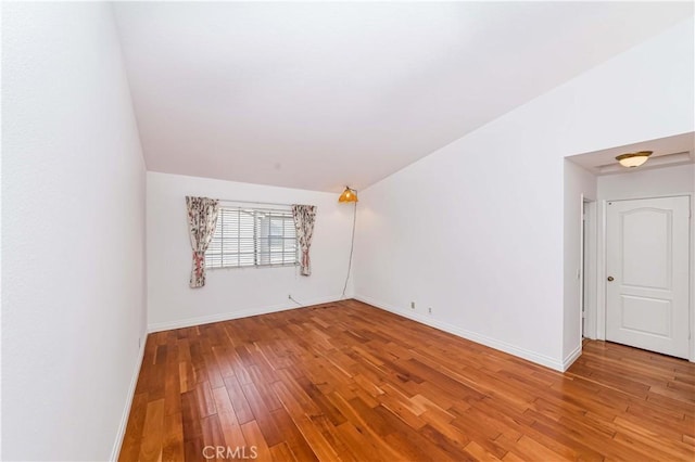 unfurnished room featuring hardwood / wood-style flooring