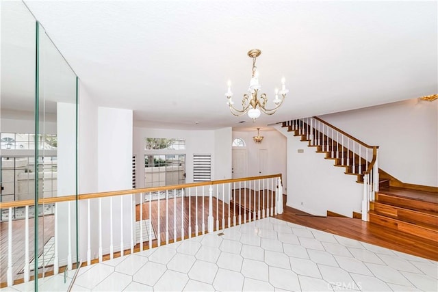 interior space featuring an inviting chandelier and hardwood / wood-style floors