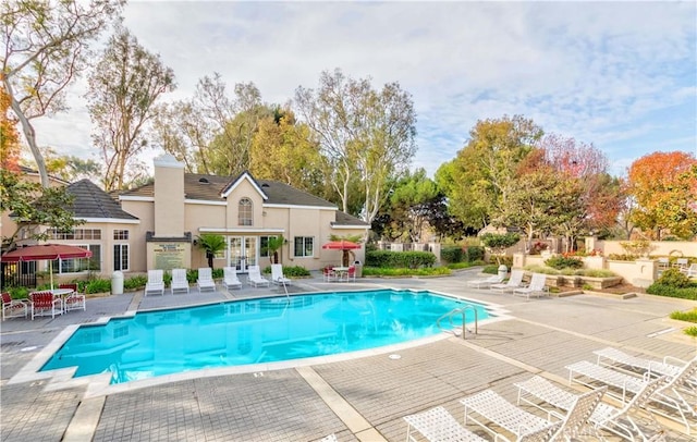 view of pool featuring a patio