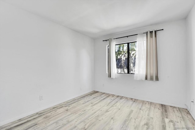 unfurnished room featuring light wood-type flooring