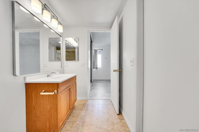 bathroom with tile patterned floors and vanity