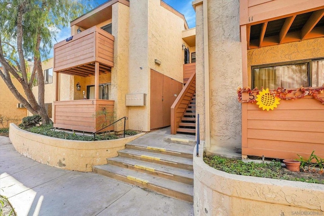 property entrance with a balcony