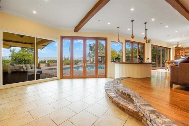 interior space with french doors and an inviting chandelier