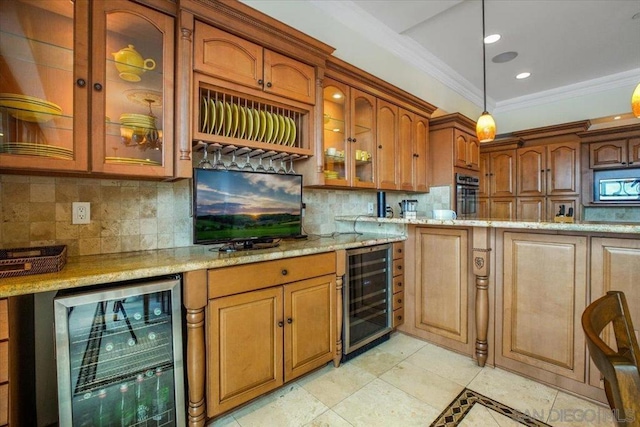 kitchen featuring light stone countertops, beverage cooler, and appliances with stainless steel finishes