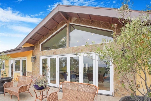 back of property featuring french doors