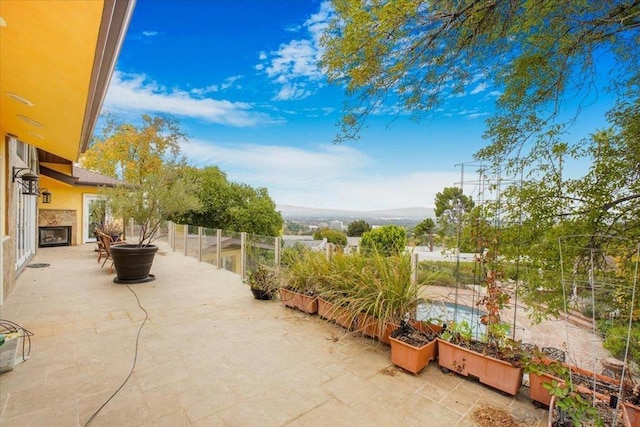 view of patio / terrace with a mountain view