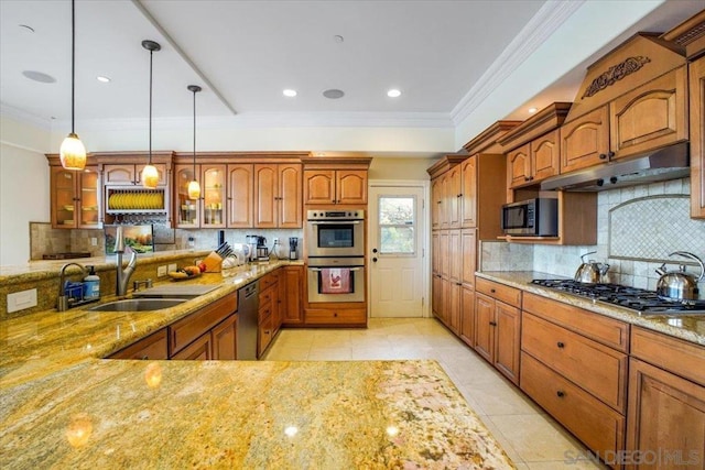 kitchen featuring backsplash, decorative light fixtures, sink, and stainless steel appliances