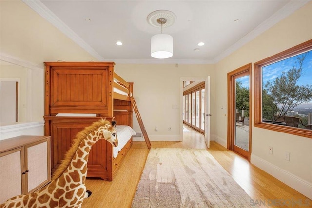 unfurnished bedroom with light hardwood / wood-style floors, ornamental molding, and access to outside