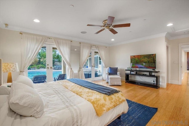 bedroom with access to exterior, ceiling fan, french doors, crown molding, and hardwood / wood-style floors