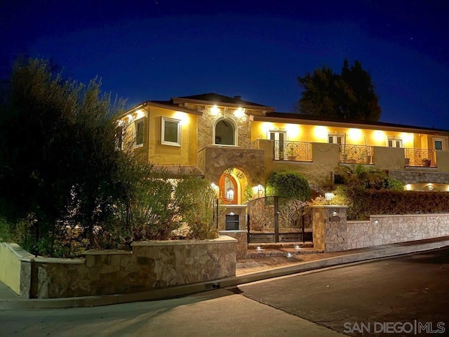 view of front of house with a balcony