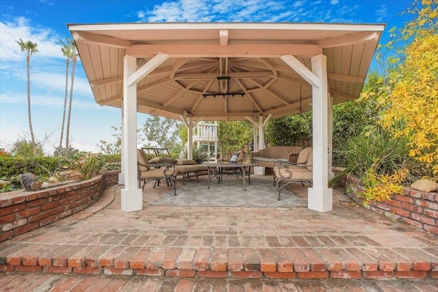 view of patio featuring a gazebo and an outdoor living space