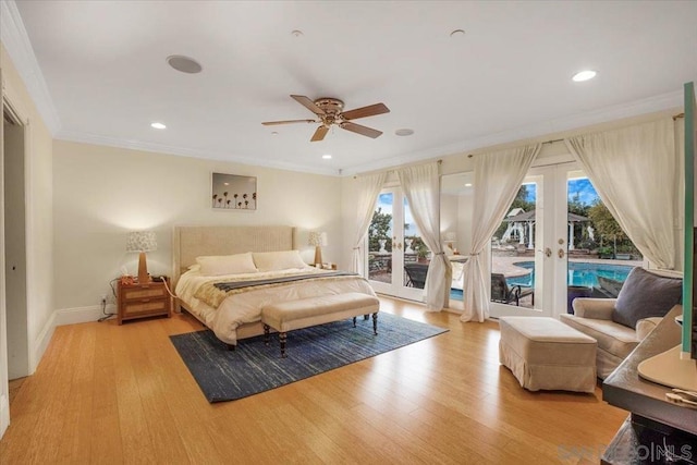 bedroom with access to outside, multiple windows, french doors, and light hardwood / wood-style floors