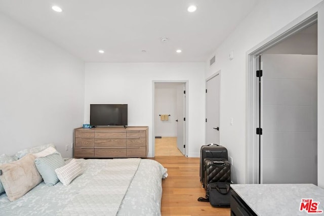 bedroom with light wood-type flooring