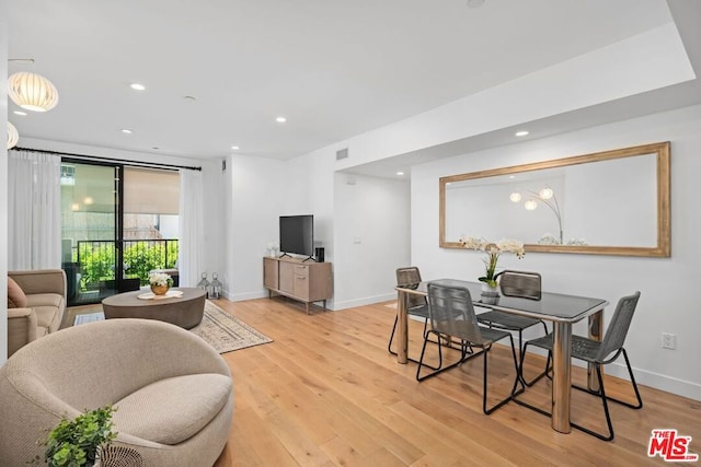 dining area featuring light wood-type flooring