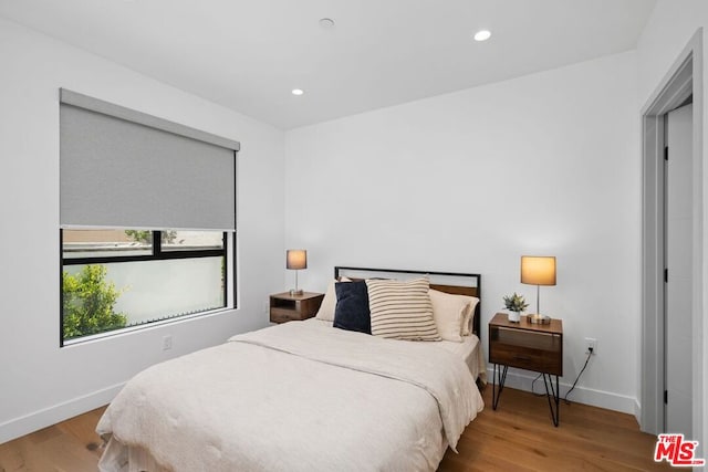 bedroom featuring light hardwood / wood-style floors