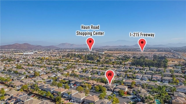 birds eye view of property with a mountain view and a residential view