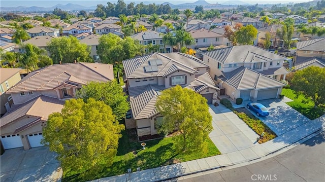 drone / aerial view featuring a mountain view and a residential view