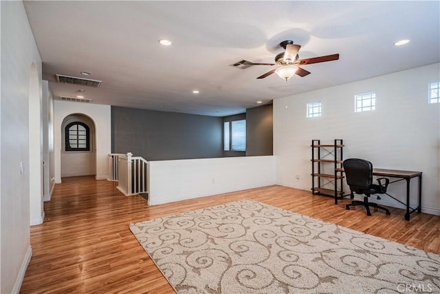 office space with recessed lighting, wood finished floors, and visible vents